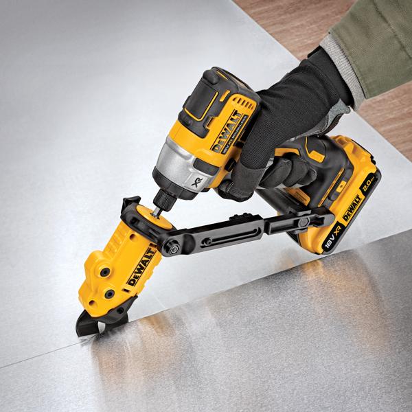 A person wearing a glove is using a yellow and black DEWALT DT70620 power tool to cut a sheet of metal. The tool is battery operated and features a cutting attachment for precision work.
